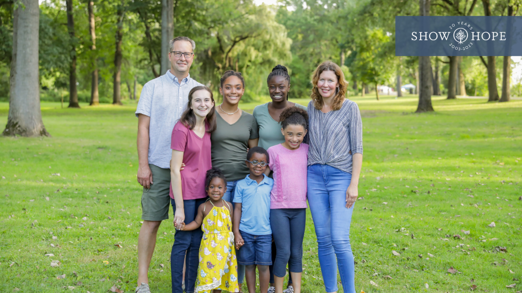 A family who received a Show Hope Adoption Aid grant all smiling together.