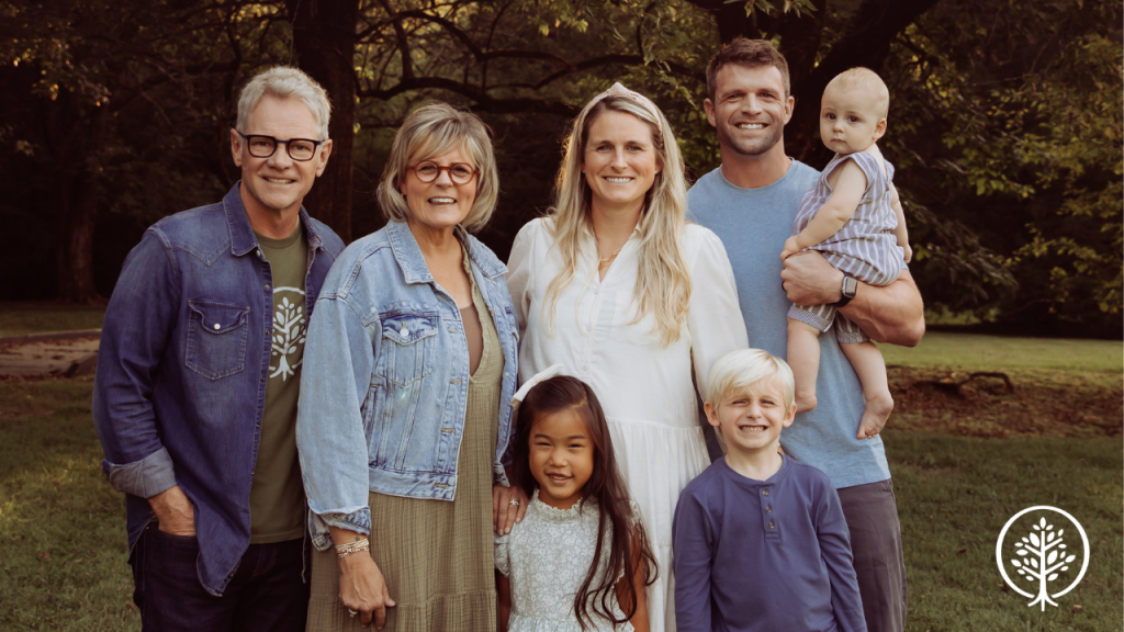 Show Hope Founders, Mary Beth and Steven Curtis Chapman, stand next to a Show Hope Adoption Aid recipient family.