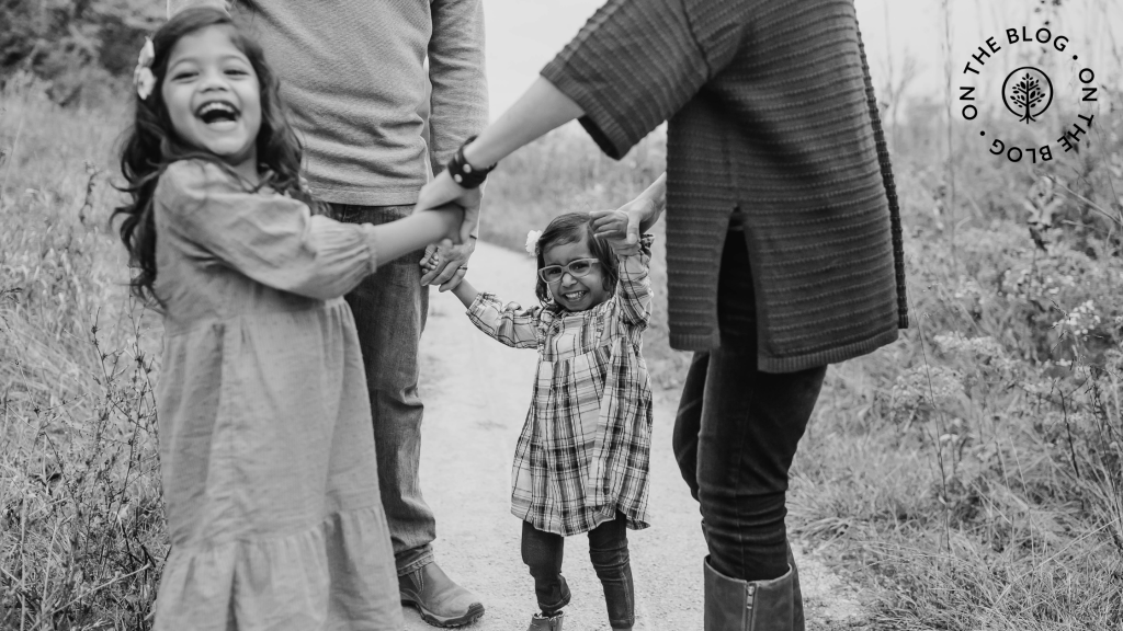 A family holding hands in a circle