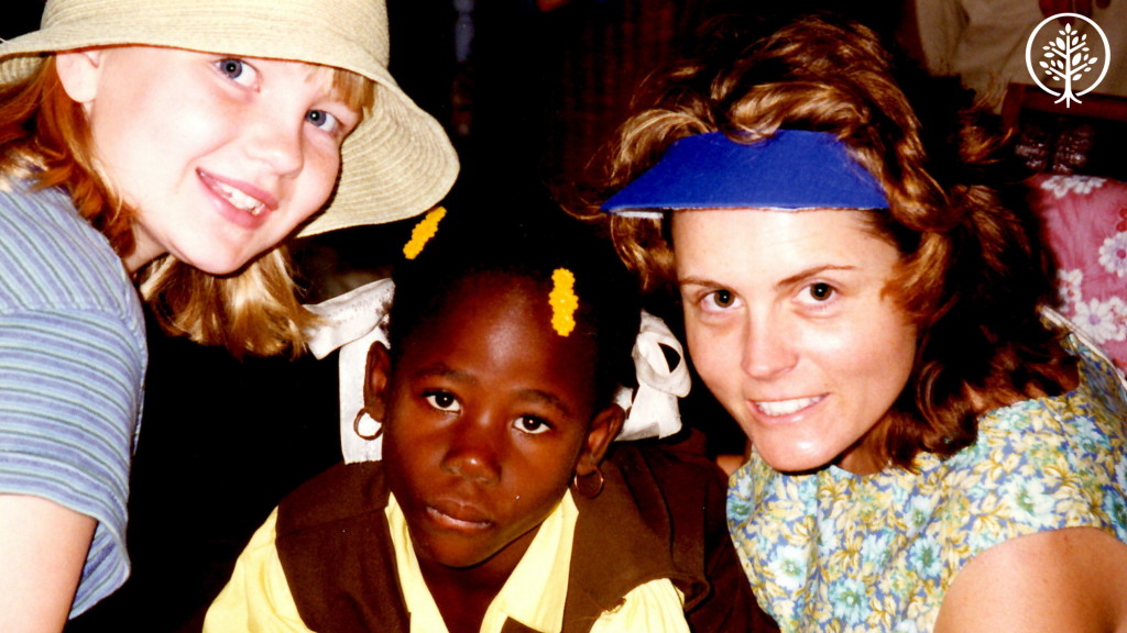 Mary Beth and Emily Chapman in Haiti with a young girl. 