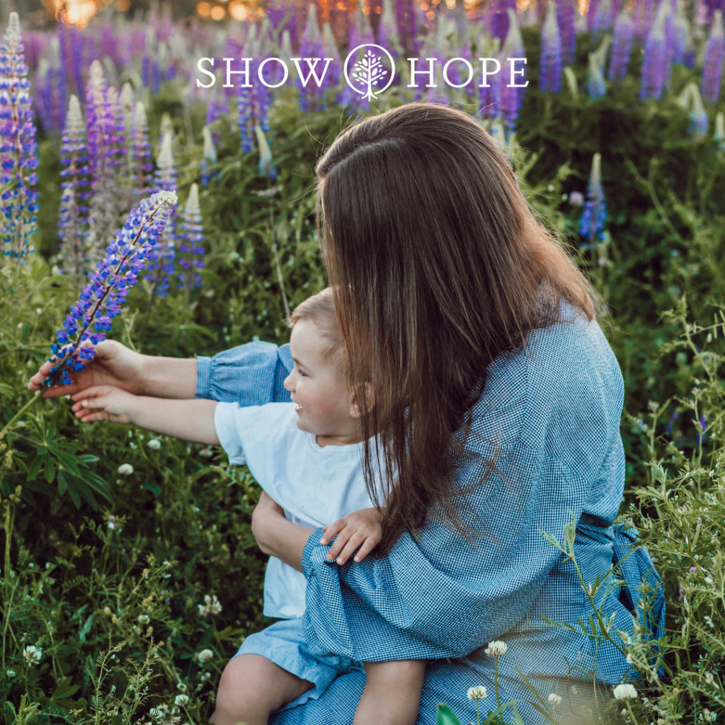 mom and child in a field