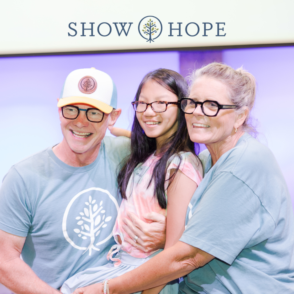 Mary Beth and Steven Curtis Chapman and a child at the Show Hope Care Centers Reunion