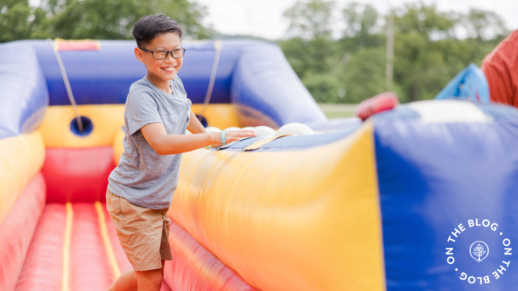 Young boy playing on an inflatable