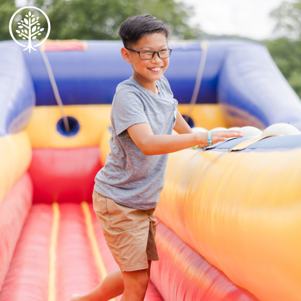 Young boy playing on an inflatable