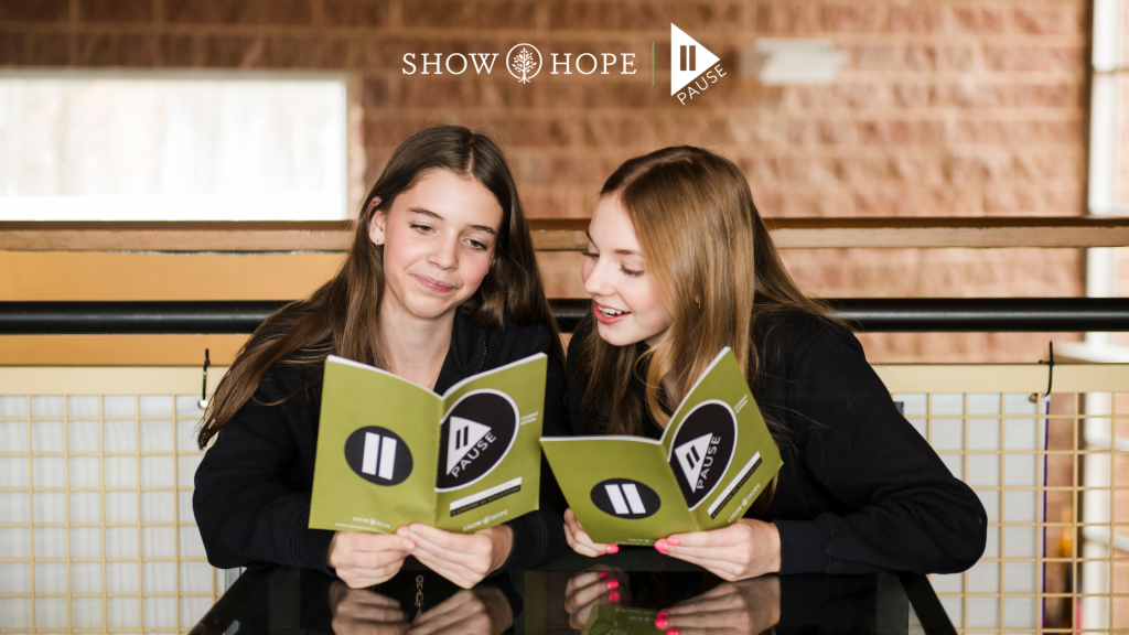 Students reading Pause Campaign books