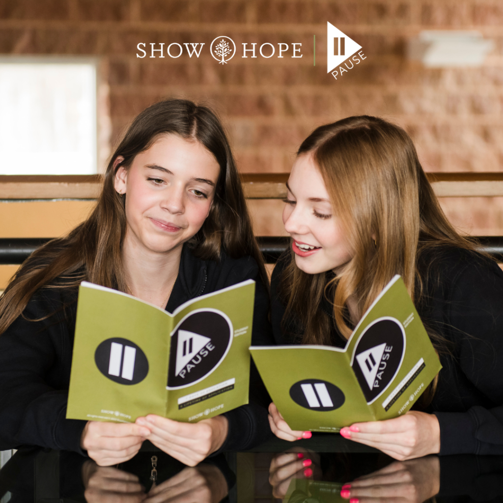 Students reading Pause Campaign books