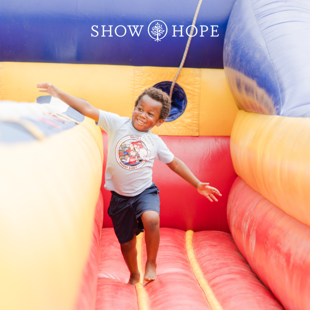 Young boy running on an inflatable